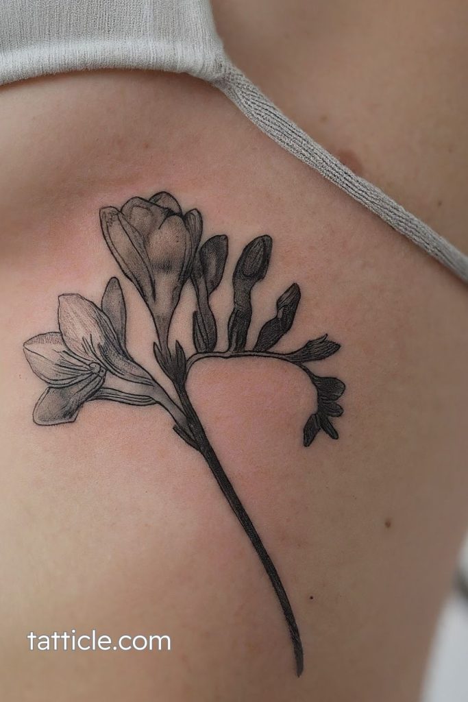 minimalist freesia tattoo design