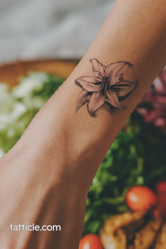 small lily tattoo wrist